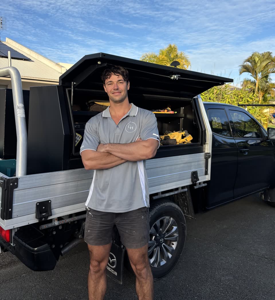 Jed Griffiths standing in front of his work ute on the Sunshine Coast